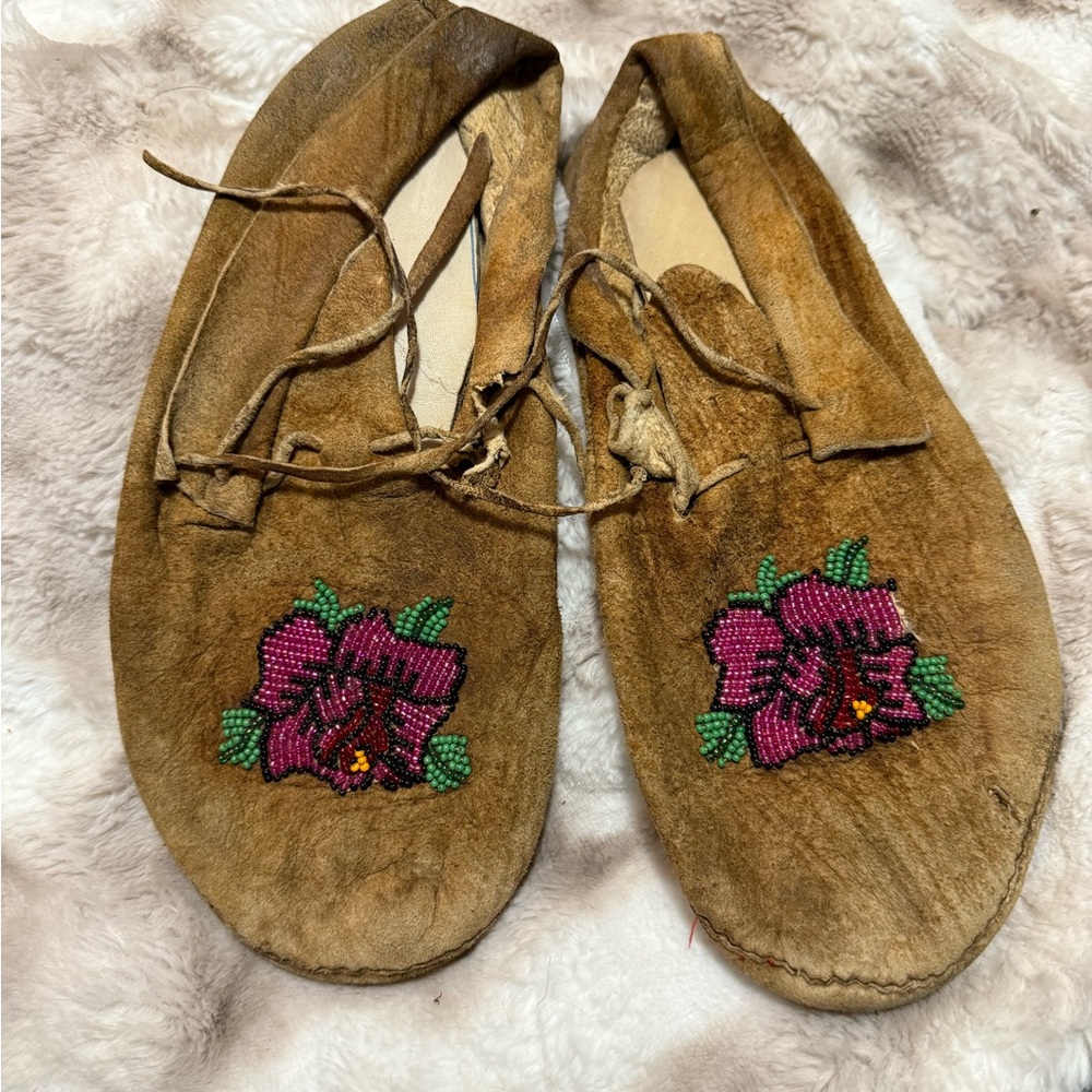 Antique Indigenous Native American leather moccasins with flower beadwork